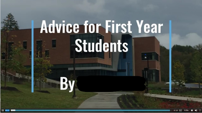 A clip from a video that shows a brick building, the title Advice for First Year Students By blank